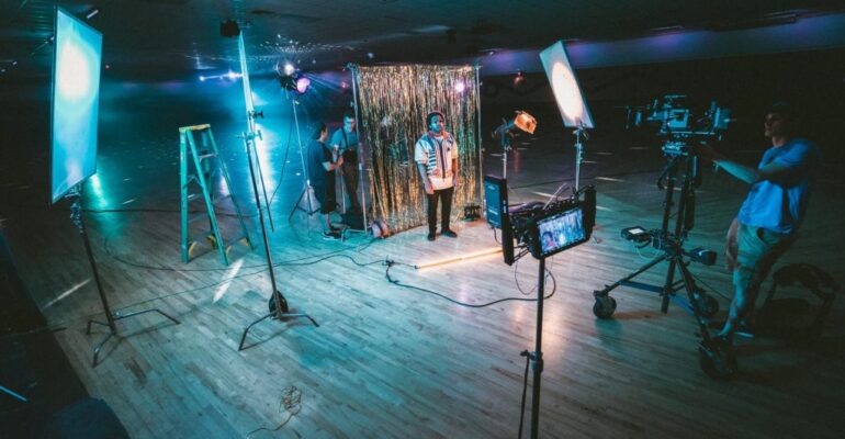 Film set with lighting and camera equipment.