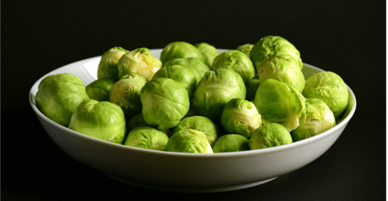 Bowl of fresh green Brussels sprouts.